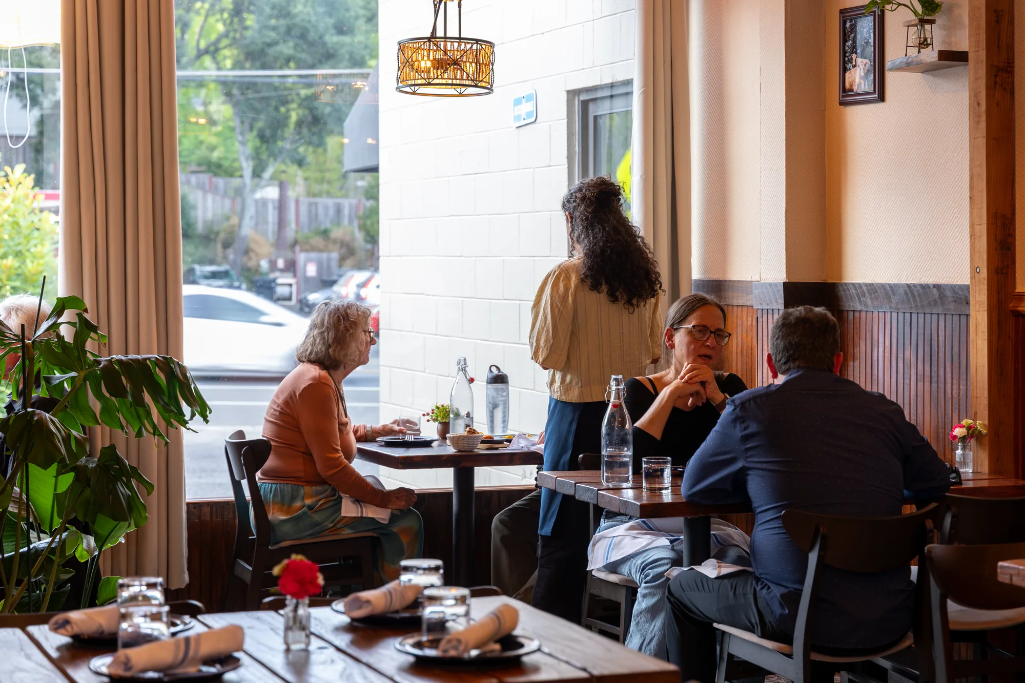 Guests dining at Alesta's window tables
